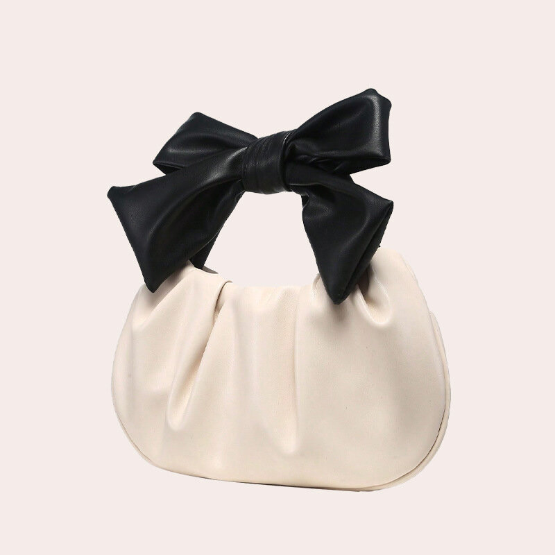Bolso de mano para mujer con lazo y diseño de almohada, de piel sintética.
