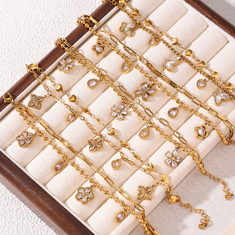 Pulseras de mujer con dije de flor, corazón, mariposa, acero inoxidable, impermeables, color dorado y circonita.