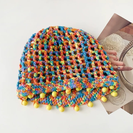 Cappello lavorato a mano in cotone intrecciato con nappina e effetto traforato, serie Ethnic Vacation, colore sfumato.