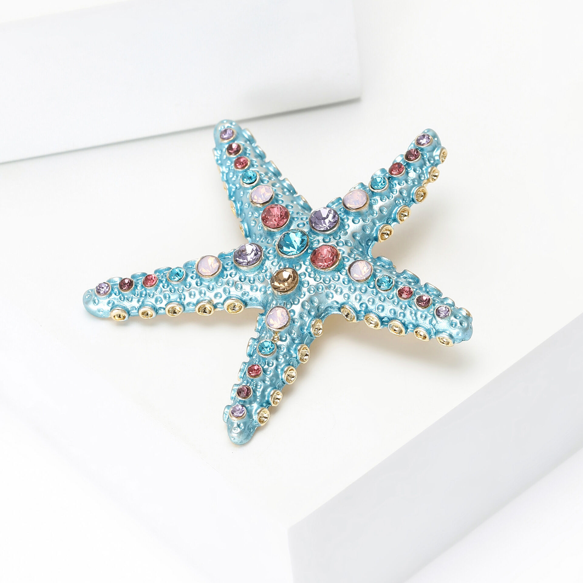 Spille di lusso in stile retrò oceanico a forma di stella marina con strass