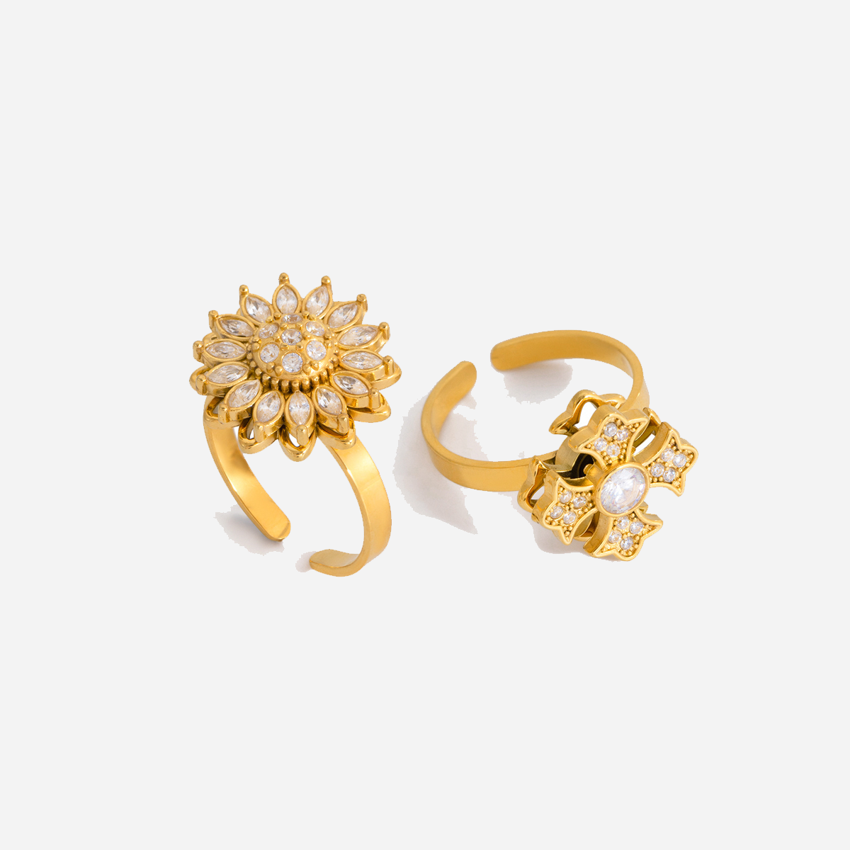 Anillos llamativos de acero inoxidable con diseño de flor giratoria, resistentes al agua y color dorado.