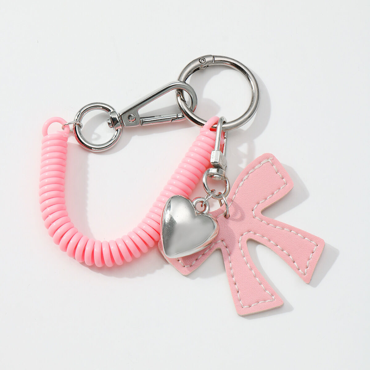 1 portachiavi con linea telefonica a forma di cuore e fiocco rosa Immagine3