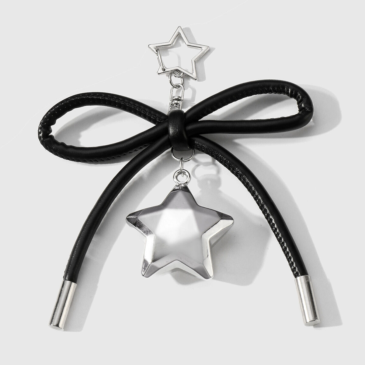 1 portachiavi a forma di stella con fiocco nero 