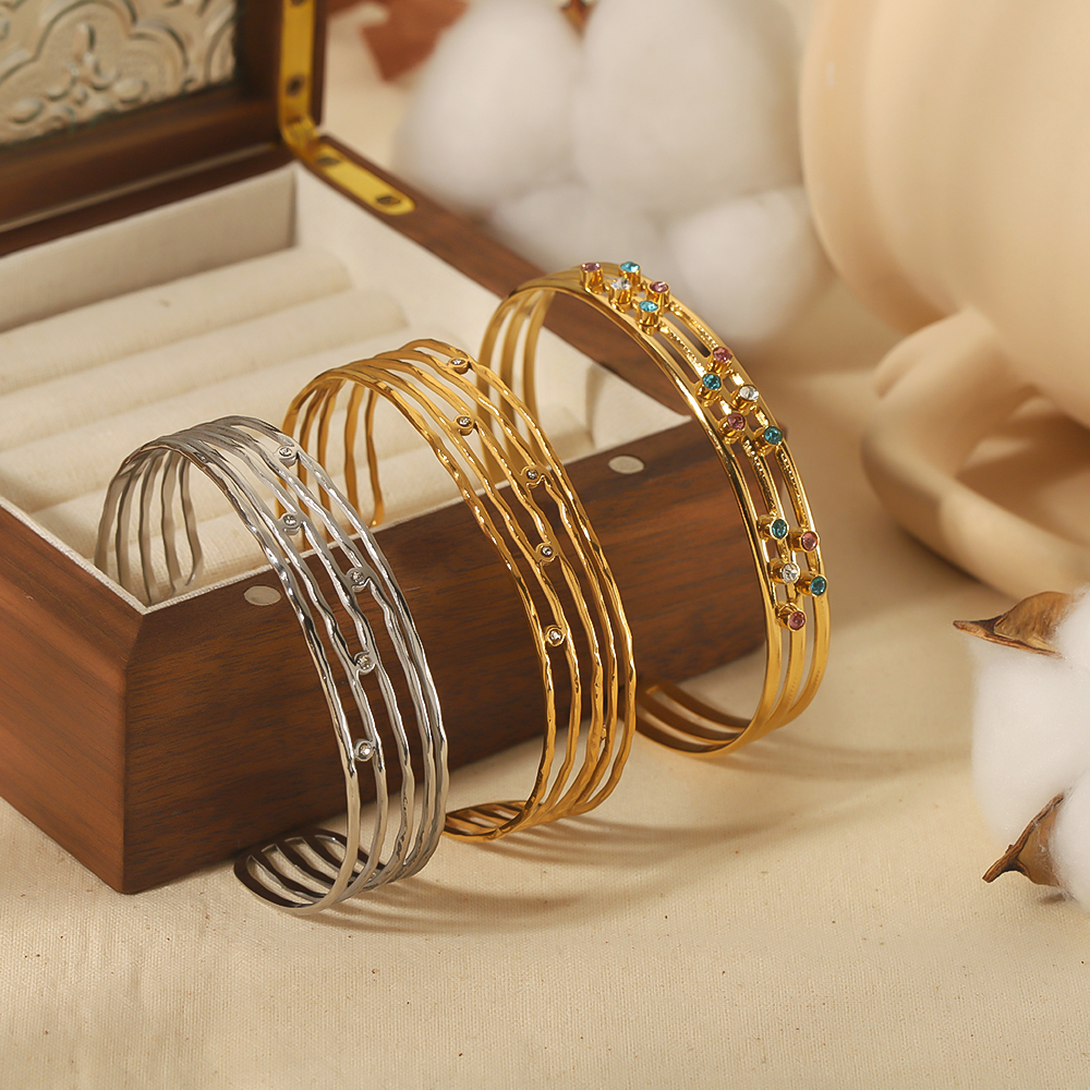 1 pair of fashionable classic  gold-plated stainless steel hollow multi-line zircon open bracelet