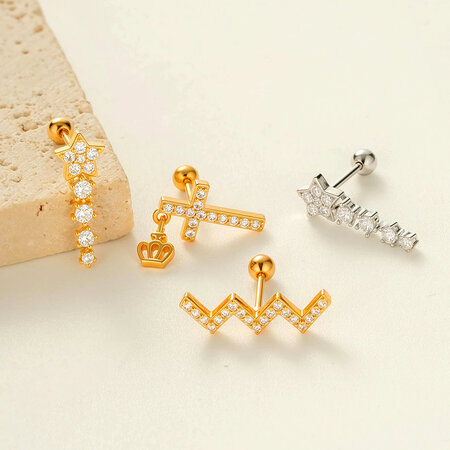 Pendientes de circonitas color cobre y dorado con forma de estrella