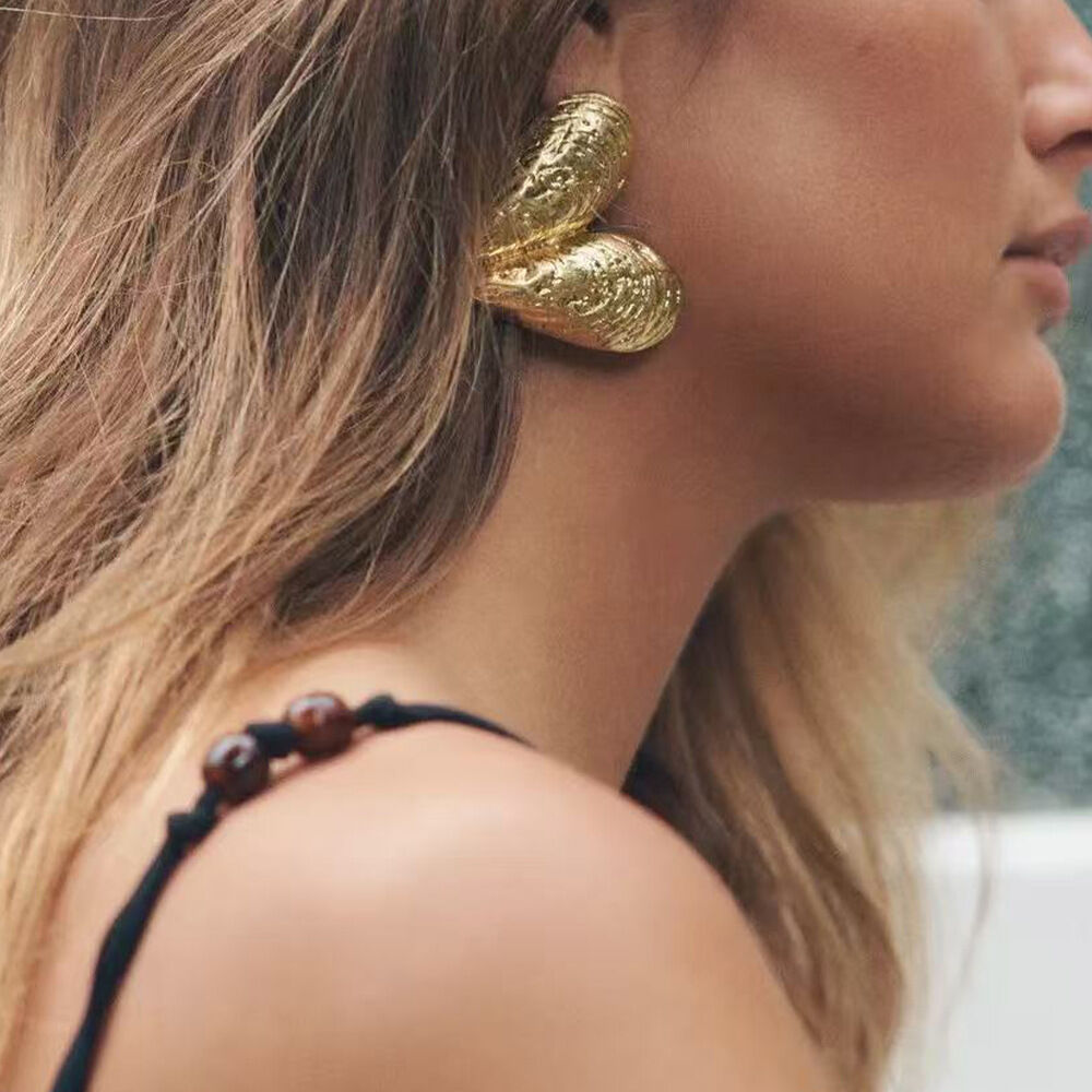 Oorbellen met schelpjes en legering