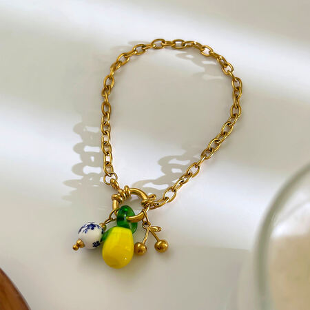 1 stuk citroenkleurige, waterdichte roestvrijstalen armband met gouden bedeltje 2