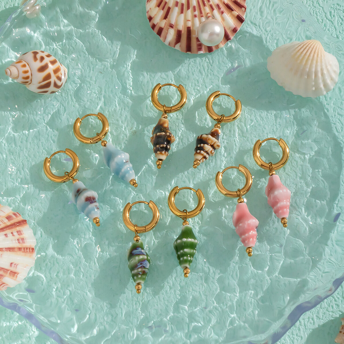 1 paire de boucles d'oreilles pendantes en céramique et acier inoxydable, couleur or, étanches.