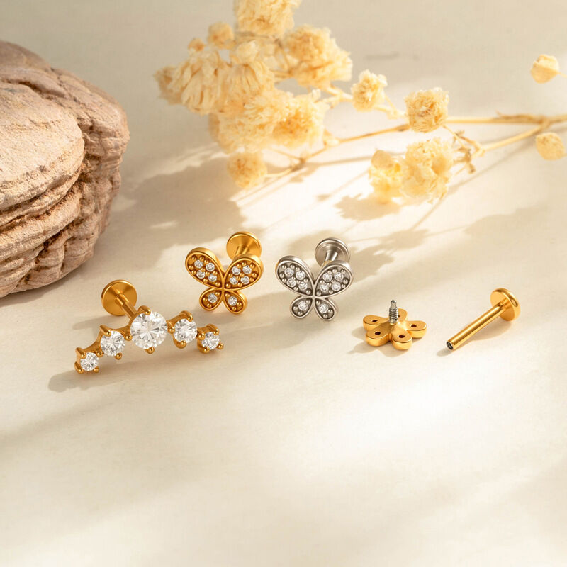 Schlichte Ohrringe mit Blumen-, Schleifen- und Schmetterlingsmotiv aus Edelstahl, wasserdicht, goldfarben, mit Zirkonia-Steinen h5 Bild3