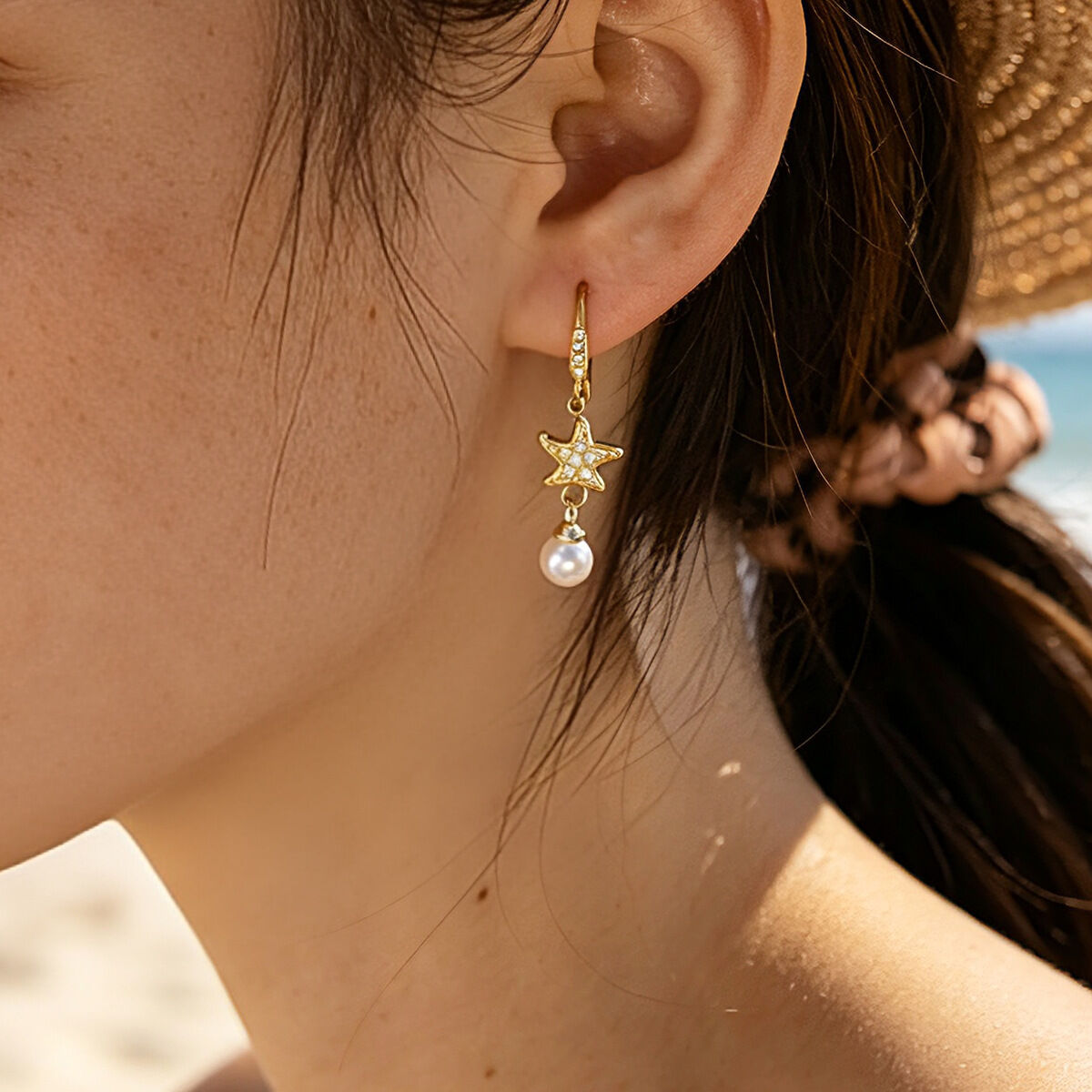 Elegante, wasserfeste Ohrhänger mit Seesternmotiv aus Edelstahl in Goldfarbe mit Zirkonia für Damen. h5 Bild2
