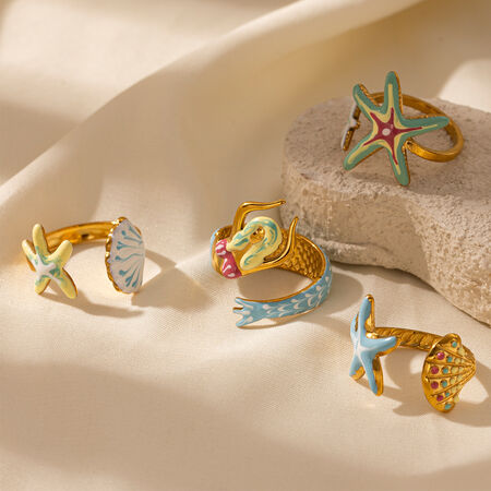 Anillos llamativos de acero inoxidable color oro, resistentes al agua, estilo oceánico, ideales para vacaciones.