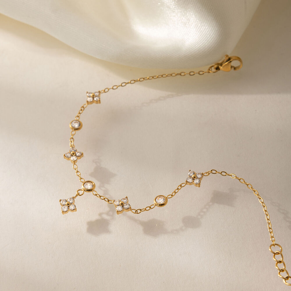 Elegante Damenhandkette aus Edelstahl mit Kleeblattmotiv, wasserdicht, goldfarben, mit Zirkonia. h5Bild4