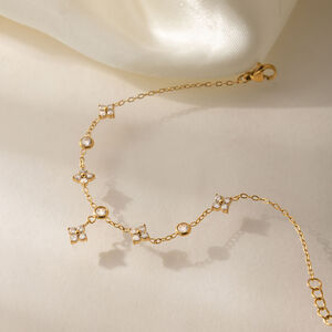 Elegante Damenhandkette aus Edelstahl mit Kleeblattmotiv, wasserdicht, goldfarben, mit Zirkonia. h5 Bild4