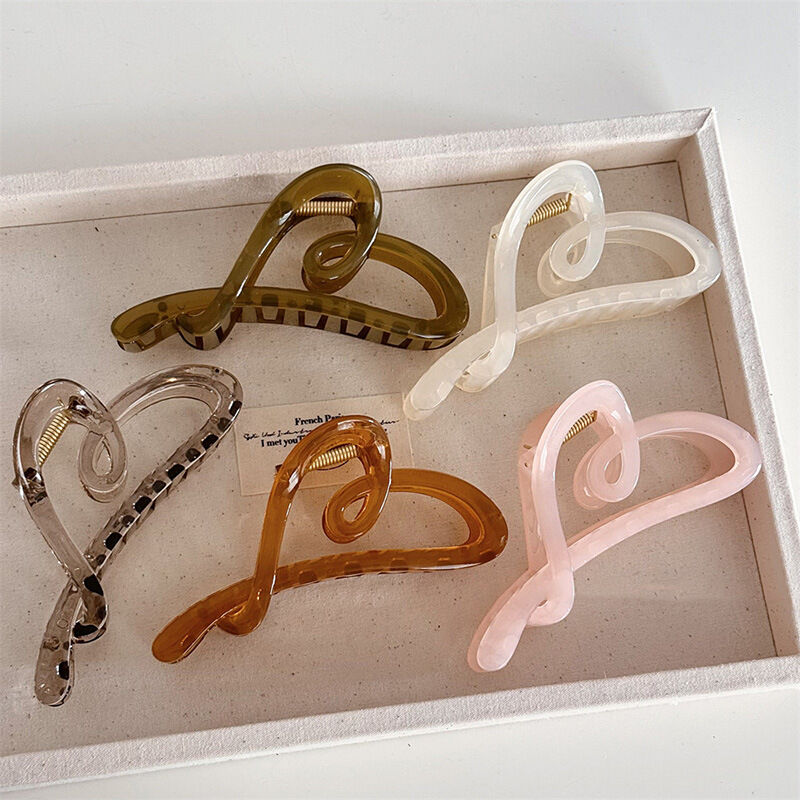 Serie romantica Cuore semplice Uncini per capelli in plastica tinta unita con motivo a cuore