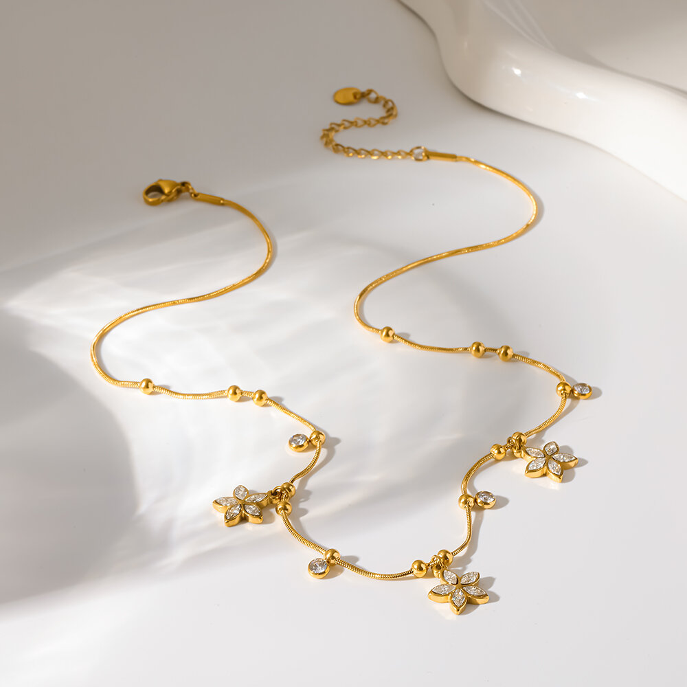 Colliers pendentifs élégants pour femmes, en acier inoxydable, étanches, couleur or, avec zircon et motif floral.