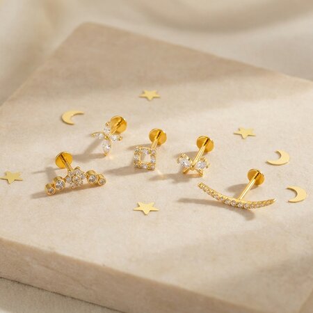 Pendientes de mujer con diseño geométrico de lazo floral, aleación de titanio color oro y circonita.