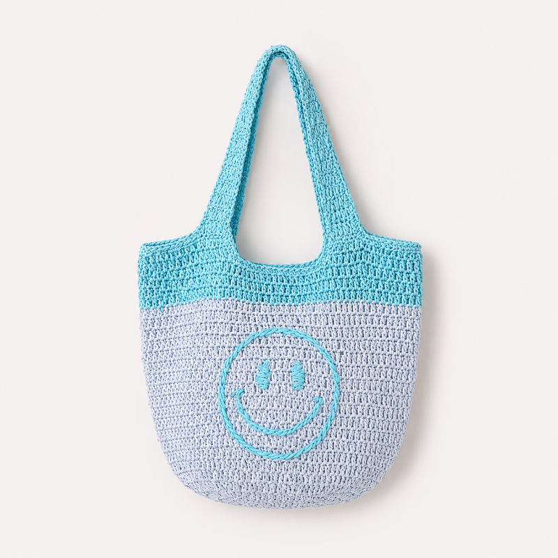 Borsa quadrata da donna in rafia intrecciata, tinta unita, con faccina sorridente, stile casual.