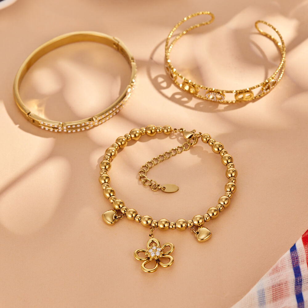 Armbanden voor dames met geometrische bloemvorm, gemaakt van roestvrij staal, waterdicht en met goudkleurige zirkonia. h5Afbeelding3