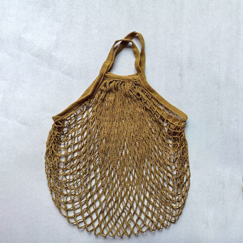 Bolso redondo de mujer de estilo casual, tejido liso, calado y con cuerda trenzada. 