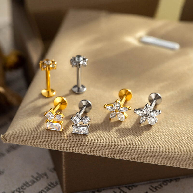 Pendientes de mujer con diseño de flor sencilla, aleación de titanio color oro y circonita. Imagen5