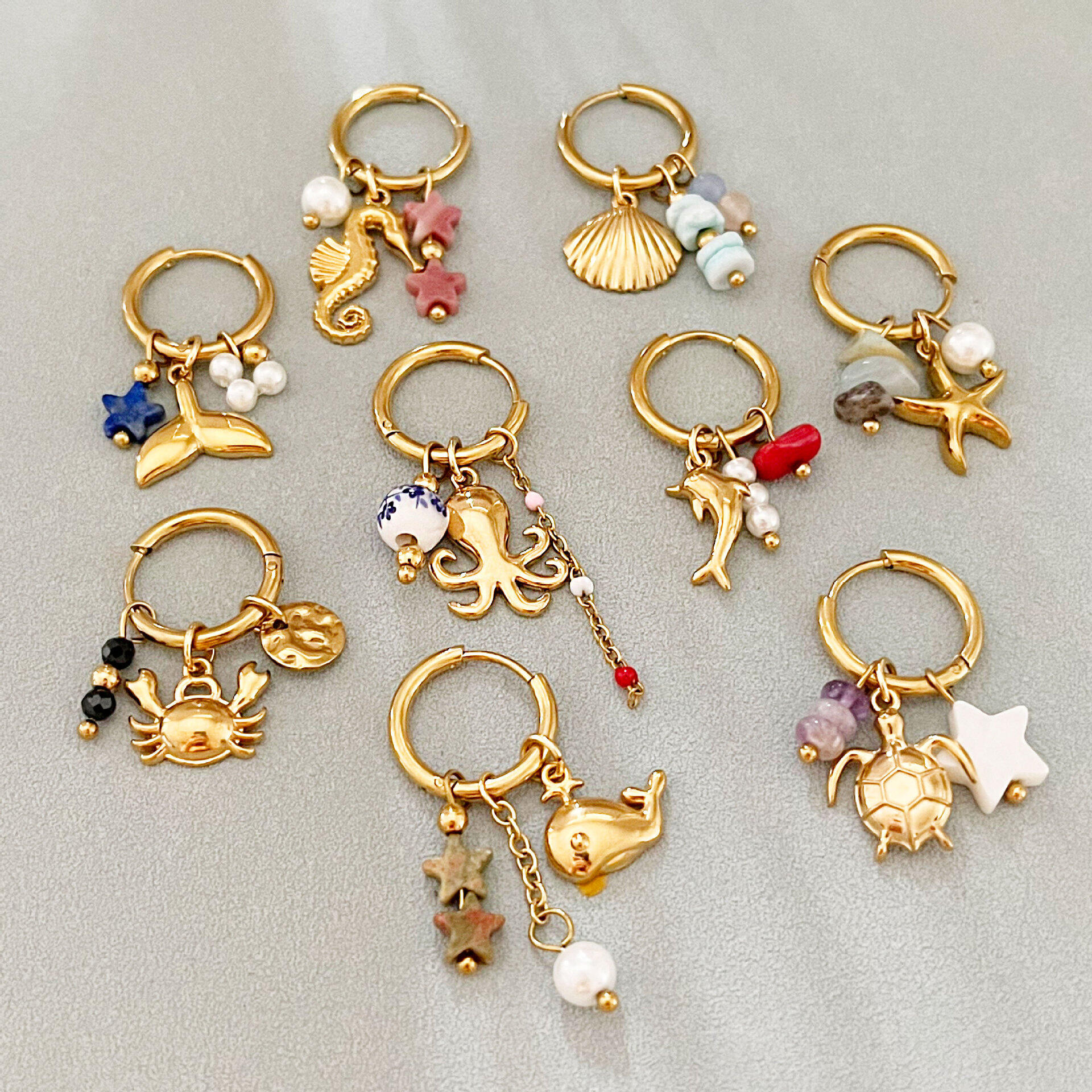 Pendientes colgantes de mujer estilo oceánico vacacional, de acero inoxidable, impermeables, color dorado.