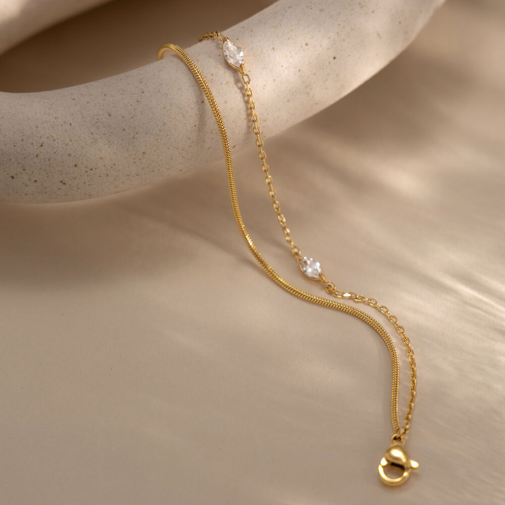 Bracciale da donna a catena semplice in acciaio inossidabile, impermeabile, color oro, con zirconi. Immagine5
