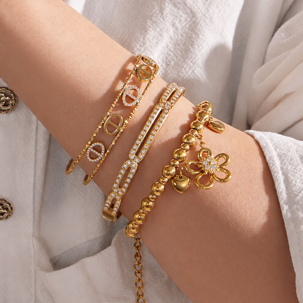 Armbanden voor dames met geometrische bloemvorm, gemaakt van roestvrij staal, waterdicht en met goudkleurige zirkonia. h5Afbeelding4