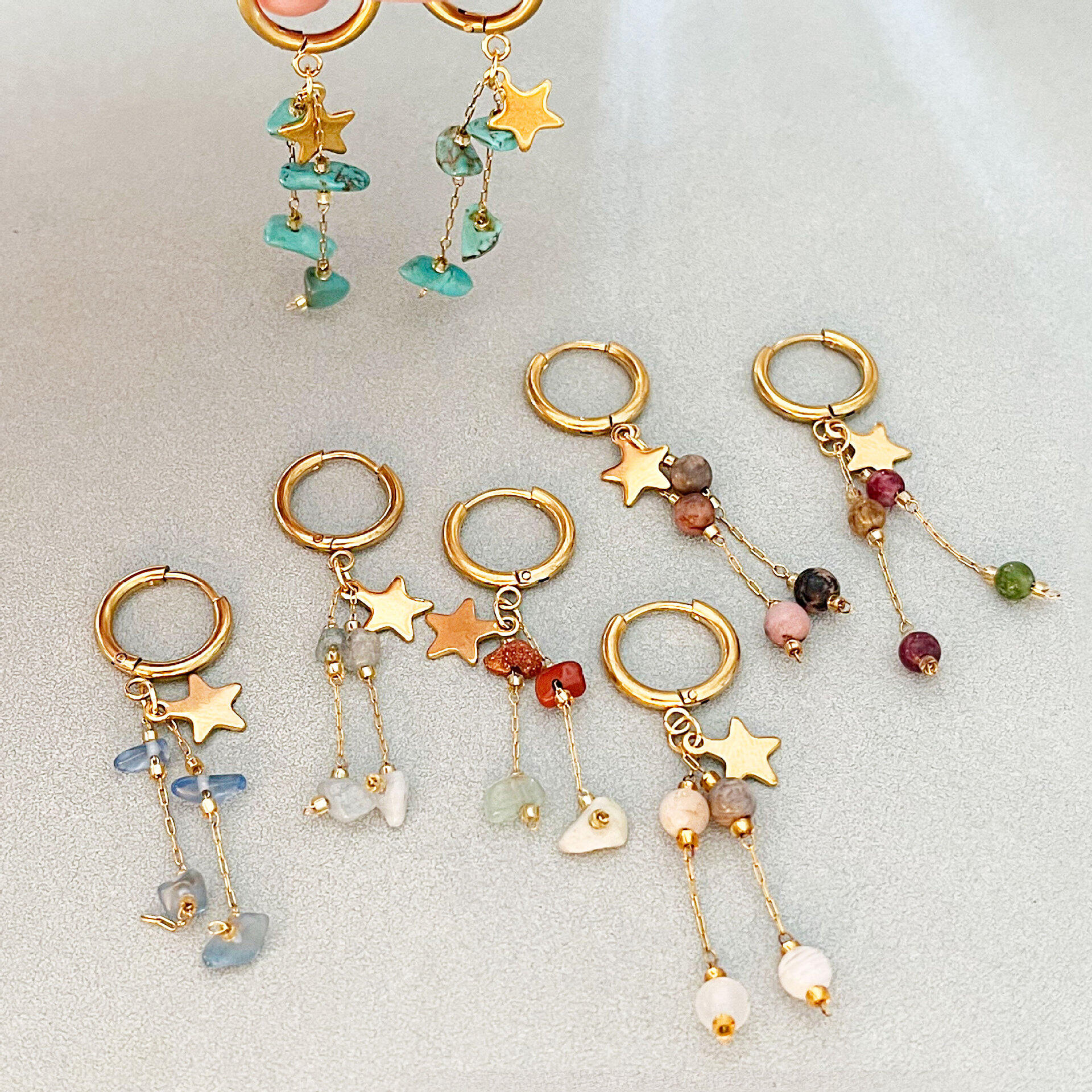 Pendientes colgantes de mujer de la serie romántica con borla en forma de estrella, de acero inoxidable, resistentes al agua y color dorado.