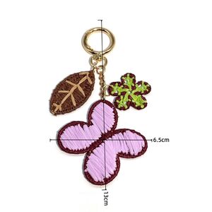 Eenvoudige serie zoete bloem- en bladmotieven geweven vlinder raffia tashangers h5