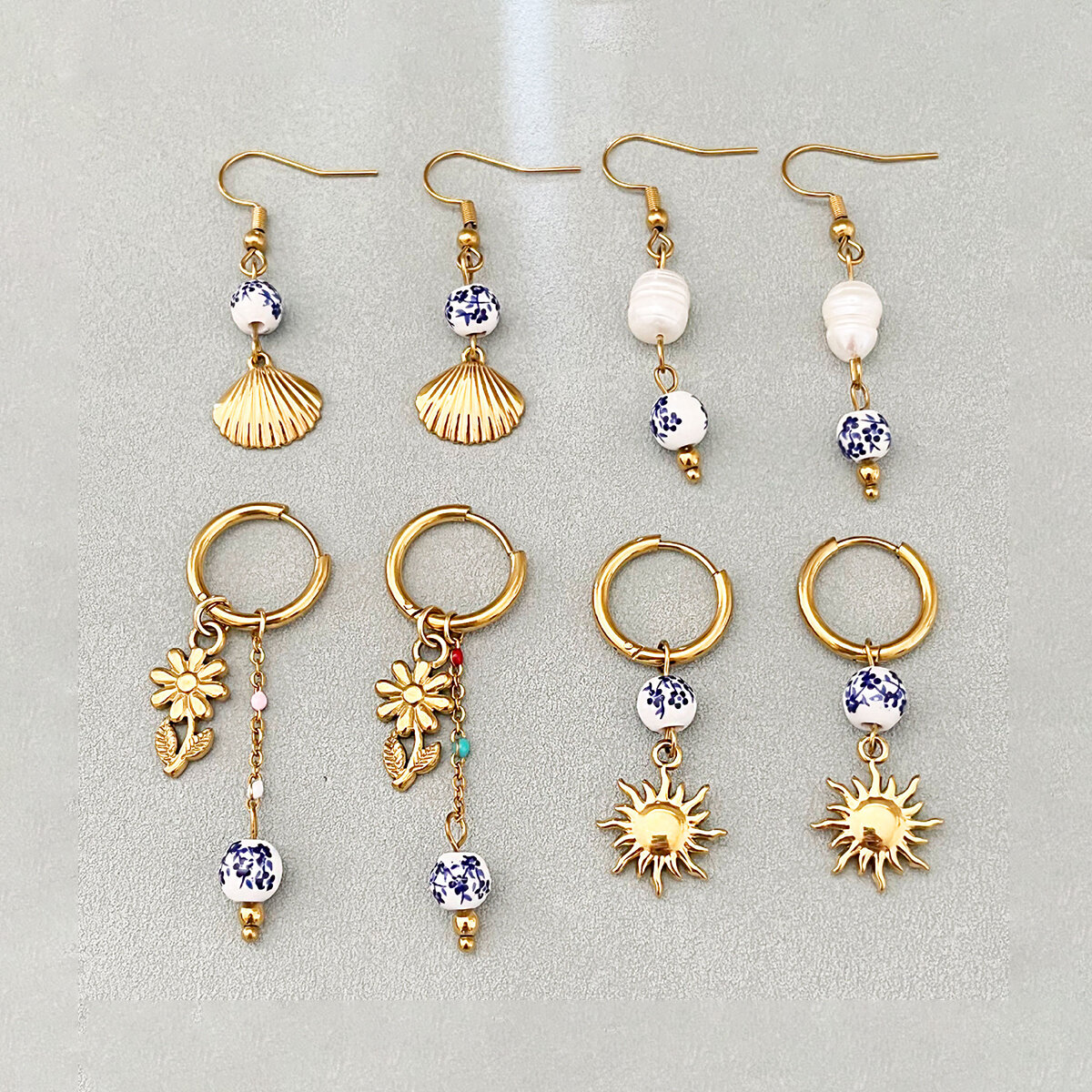 Pendientes colgantes de acero inoxidable color dorado, estilo oceánico, de la serie étnica, ideales para vacaciones.