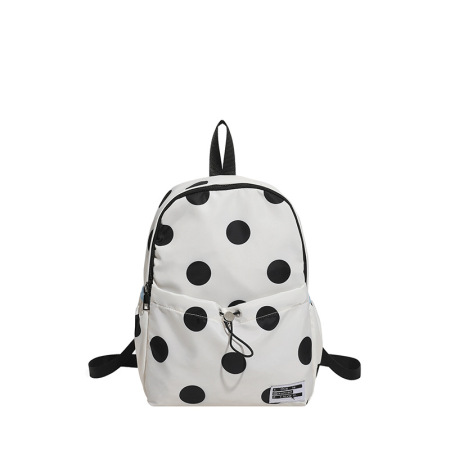 Mochila de mujer de estilo casual con estampado de lunares en tela de colores variados.
