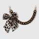 One amber-colored bow bag charm